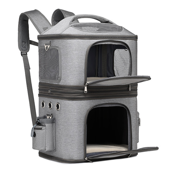 Angled perspective of grey dual-layer pet travel backpack with opened front mesh entry doors for both compartments.