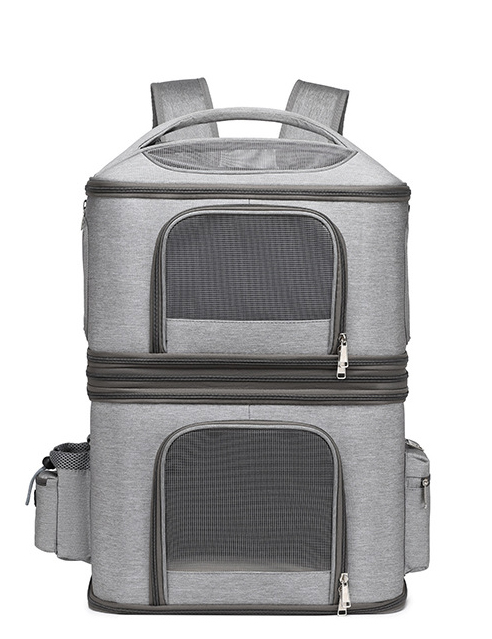 Front view of heather grey double-deck pet backpack carrier featuring mesh ventilation windows and zippered storage pockets.